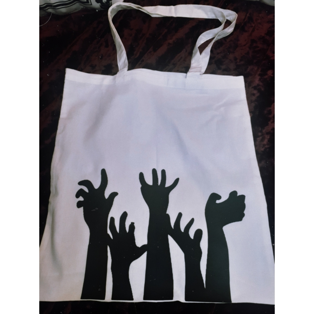 Black and white zombie hands tote bag